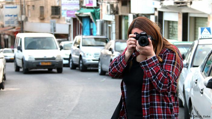 Young female reporter working her way in Jerusalem